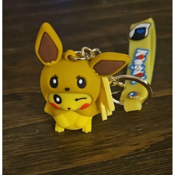Pokemon Pikachi Evee Disguise Keychain with Lightning Bolt Charm - Picture 1 of 3